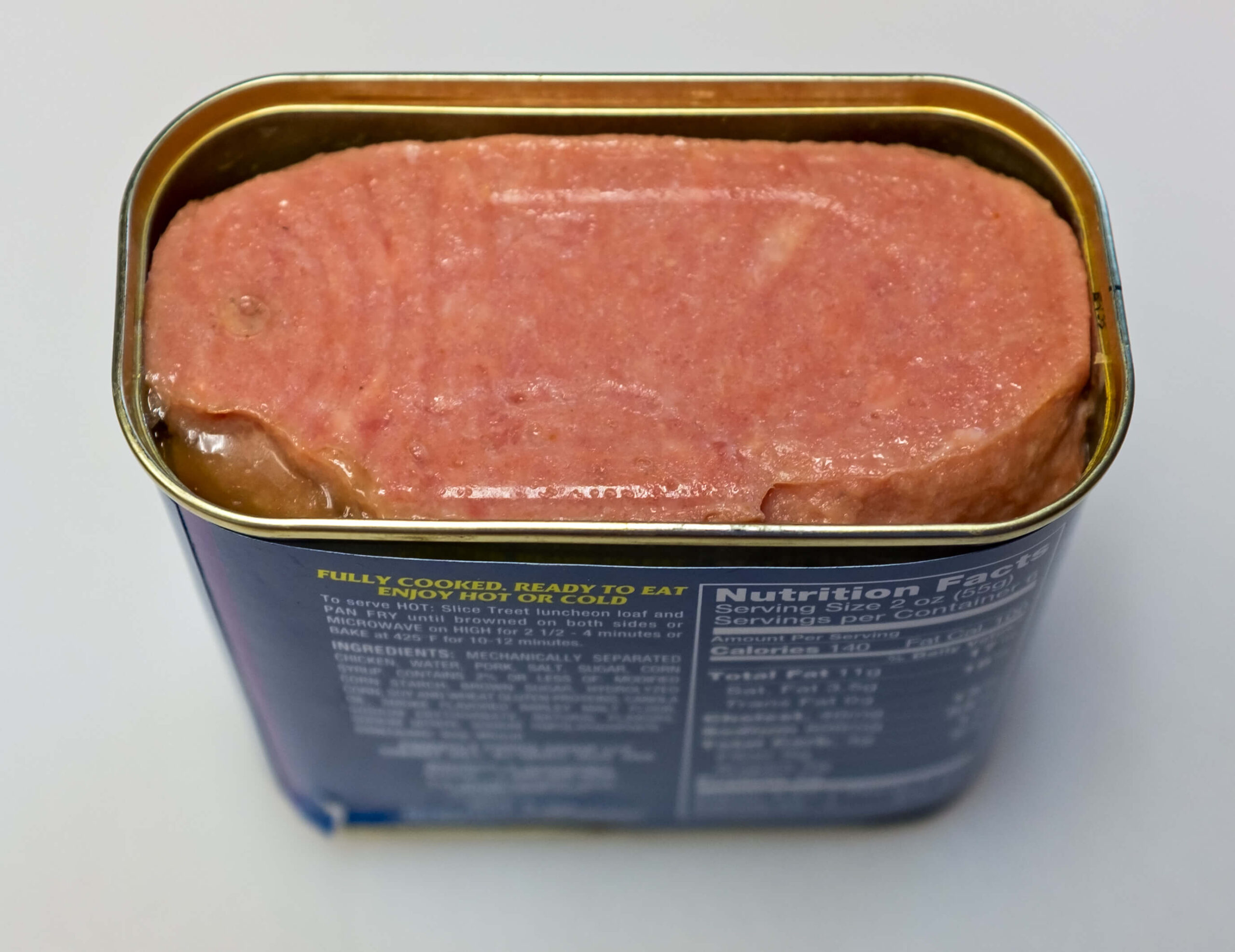 open tin of ultra processed meat