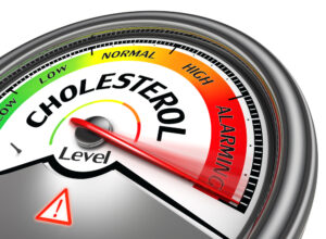A cholesterol meter with a red light on it, ideal for monitoring cholesterol levels while following a Mediterranean diet.